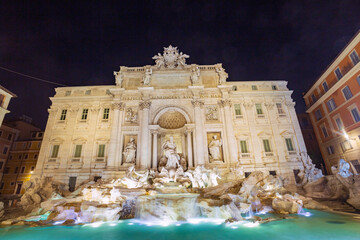 Trevi Fountain 
in Rome at night. A Baroque monument