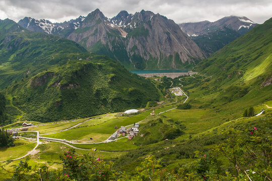 Beautiful and panoramic view of Riale walser village and Morasco dam in Val Formazza, Piedmont alps, Italy