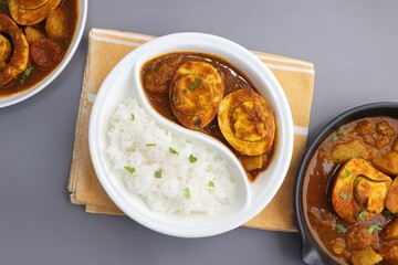 Indian non-vegetarian food  Homemade Egg Curry or Anda masala gravy, baida curry. Indian spicy food. Perfect Indian lunch. over moody background with copy space.