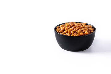White beans in tomato sauce in bowl isolated on white background. Copy space