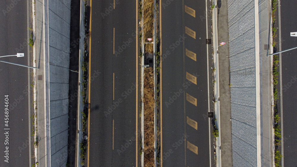 Wall mural Aerial view of cars walking on a suburban street