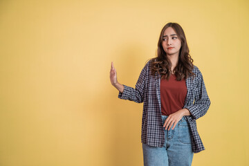 attractive woman with refusing offer gesture pose with copyspace