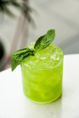 Refreshing basil cocktail served outdoors