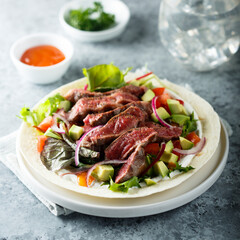 Beef steak fajitas with avocado and onion