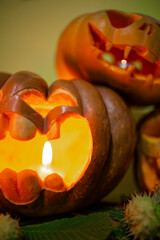 carved pumpkin faces for halloween with candles