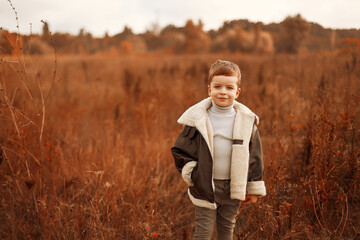 child in autumn forest, child in autumn leaves, autumn landscape, child in autumn park