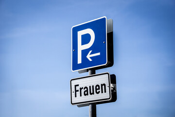 Parking where is written the word: Woman. Place for special parking slots for woman