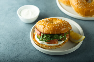 Bagel sandwich with salmon and arugula