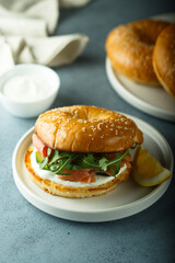 Bagel sandwich with salmon and arugula