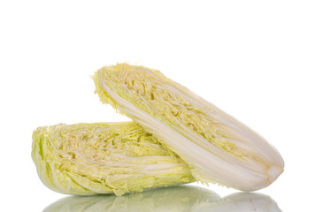 Two half ripe fresh Peking cabbage, close-up, isolated on white.