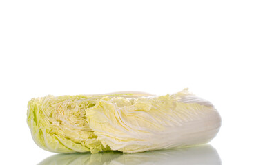 Two half ripe fresh Peking cabbage, close-up, isolated on white.