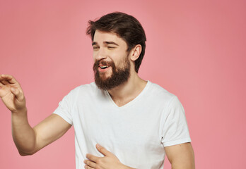 Obraz premium emotional man in a white t-shirt serious look Studio