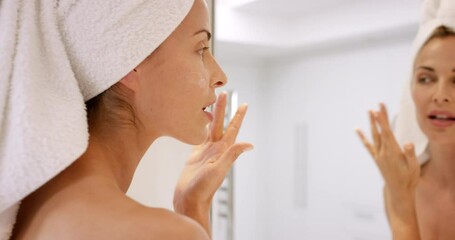 beautiful woman applying skincare lotion to face caring for skin with feminine beauty products - Powered by Adobe