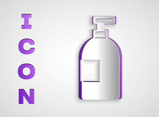 Paper cut Dishwashing liquid bottle icon isolated on grey background. Liquid detergent for washing dishes. Paper art style. Vector