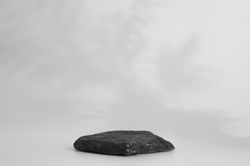 Rock podium on the white background. Stone podest for product, cosmetic presentation. Creative mock...