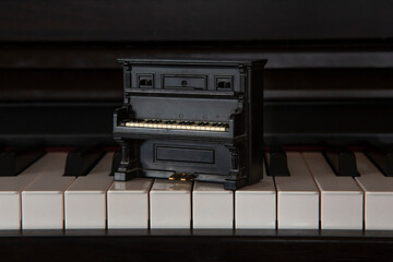 Piano toy on a piano. Close up photography.