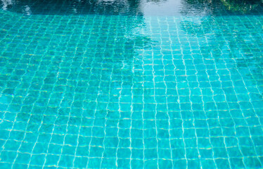 Part of swimming pool and with blue water.