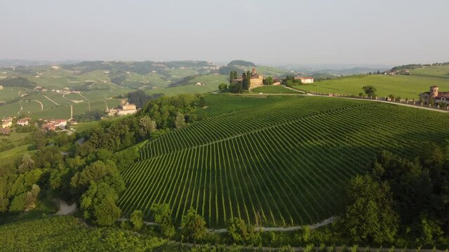 La Volta and Falletti castles aerial view situated in Barolo, Langhe region, Piedmont (Piemonte), Northern Italy. Famous Italian castle tourism travel destination in Europe. Surrounded by vineyards.