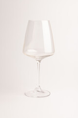 Empty transparent wine glass on the white background