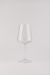 Empty transparent wine glass on the white background