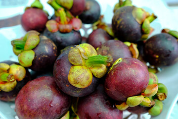 mangosteen fruit on a plate