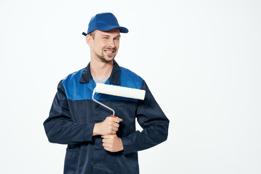Man in working form instruments Professional light background
