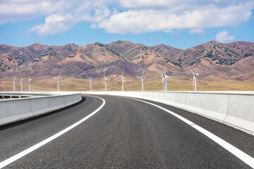Highway ground and mountain natural scenery under blue sky.Landscape and highway.Outdoor road background.