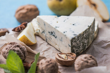 Gorgonzola picant Italian blue cheese, made from unskimmed cow's milk in North of Italy. Piece of blue mould cheese danablu,  roquefort with pear and walnuts