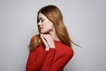 pretty woman fashion hairstyle red sweater model light background