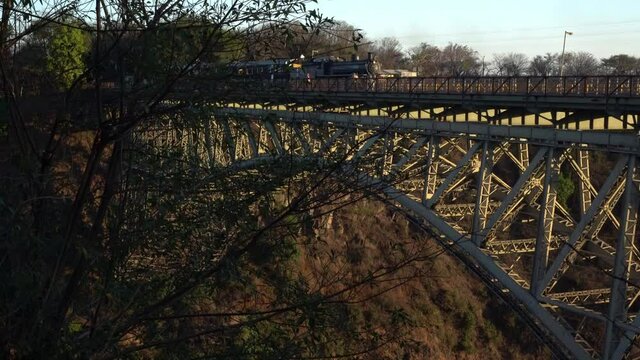 steam train crosses the Victoria Falls Bridge, Zimbabwe Zambia border