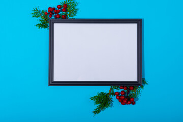 Composition of white card in frame with copy space and tree branches on blue background