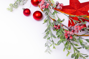 Composition of christmas decorations with baubles, branches and copy space on white background
