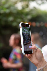 the screen of a mobile phone or cell phone whilst someone takes a video