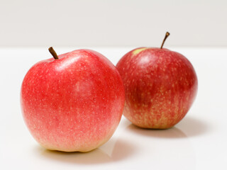Red apples close-up over the white background