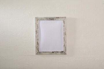 Composition of white card in frame with copy space on white background