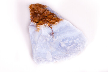 Macro mineral blue agate in the rock on white background