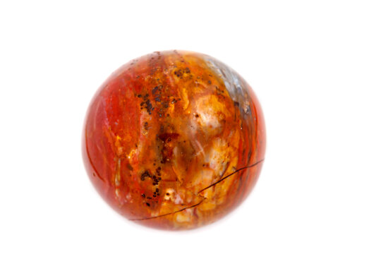 Macro mineral stone jasper ball on white background