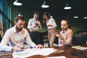 Workers discussing business project in office