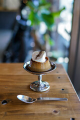 The custard pudding on the table