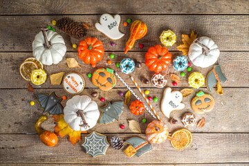 Halloween cookies, sweets and decor background. Trick or treat concept. Traditional halloween...