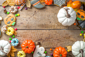 Halloween cookies, sweets and decor background. Trick or treat concept. Traditional halloween...