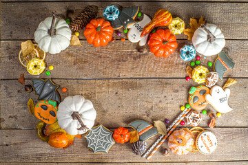 Halloween cookies, sweets and decor background. Trick or treat concept. Traditional halloween...