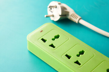 Electrical switch and plug on color background,