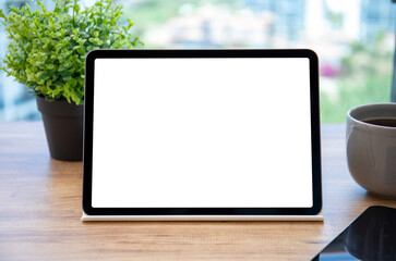 computer tablet with isolated screen over table in office