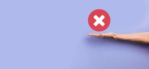 Hand holds icon,cancellation symbol,cancel icon.Cross mark flat red icon.round X mark.cancel button.Wrong.cross mark rejection.Declined.On grey background.Banner.Copy space.Place for text.