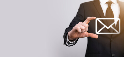 Male hand holding letter icon,email icons .Contact us by newsletter email and protect your personal...