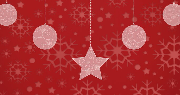 Digital image of christmas bauble and star decorations against snowflakes print on red backgroun