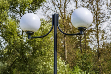 Vintage iron lantern in a public park in the daytime