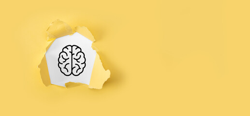 Torn yellow paper with brain and icon tools, device, customer network connection communication on...