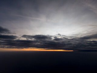 Sunrise view to sky and clouds from high altitude